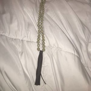 Long beaded necklace with tassel detail